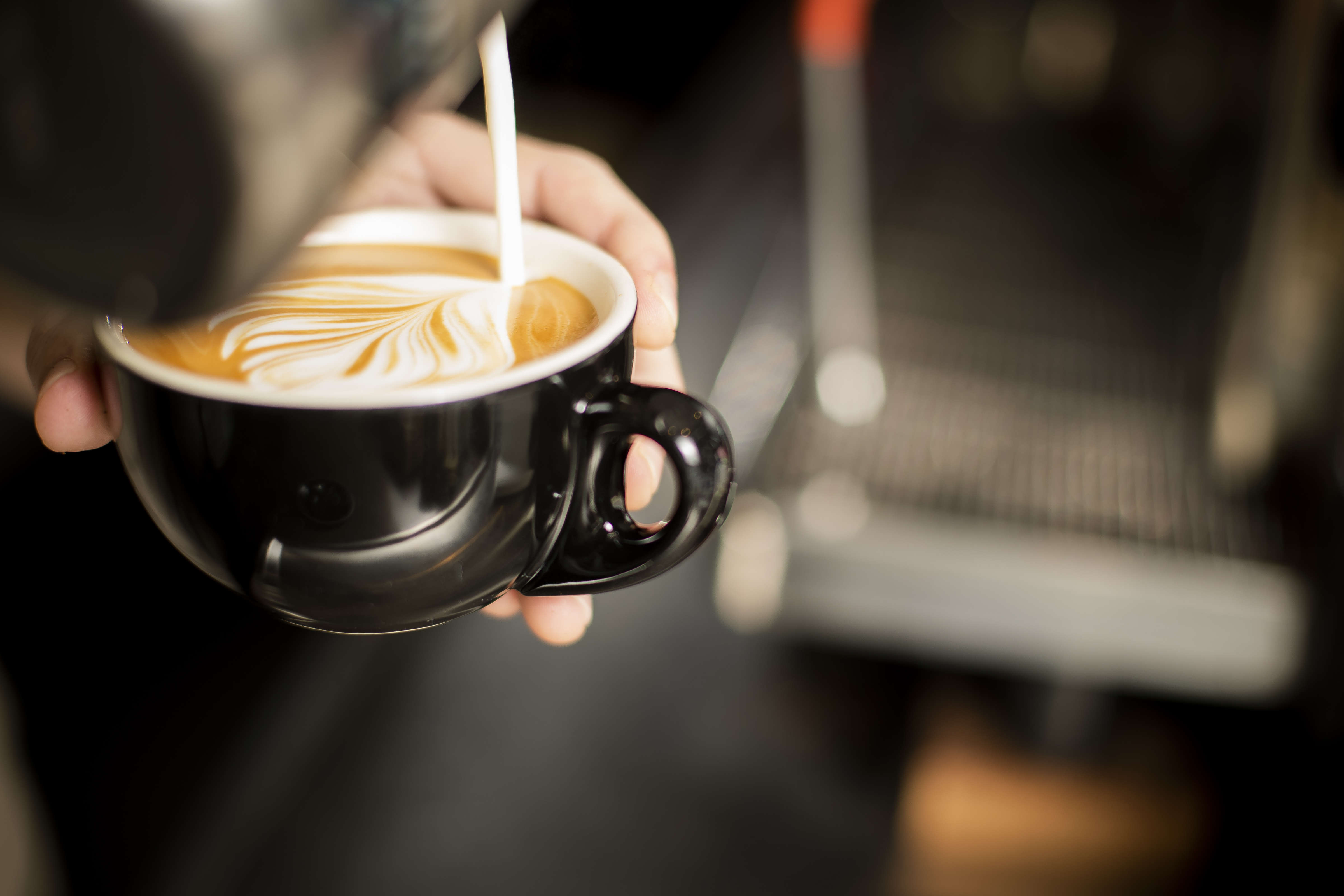 Artistically poured milk in a flat white coffee. Photo: Richard Jupe.